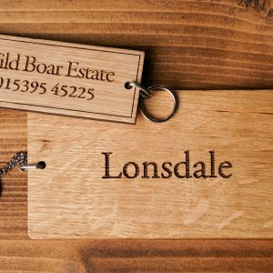 Wooden, engraved, key rings made from oak with key chain attached.