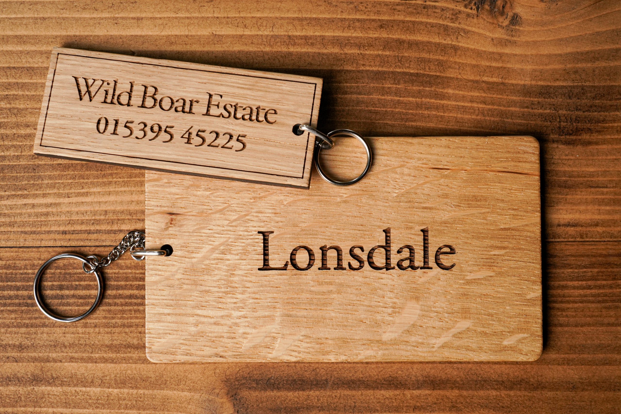 Wooden, engraved, key rings made from oak with key chain attached.
